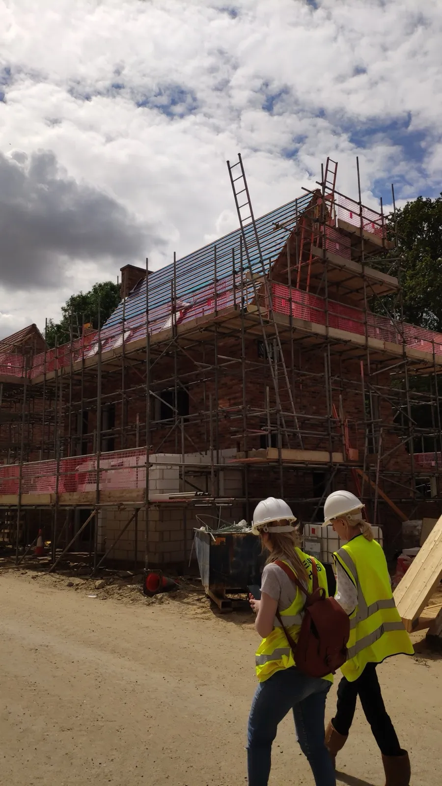 Site visit during construction, scaffolded new build