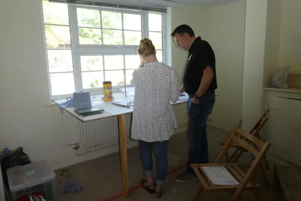 Reviewing drawings with a client on site