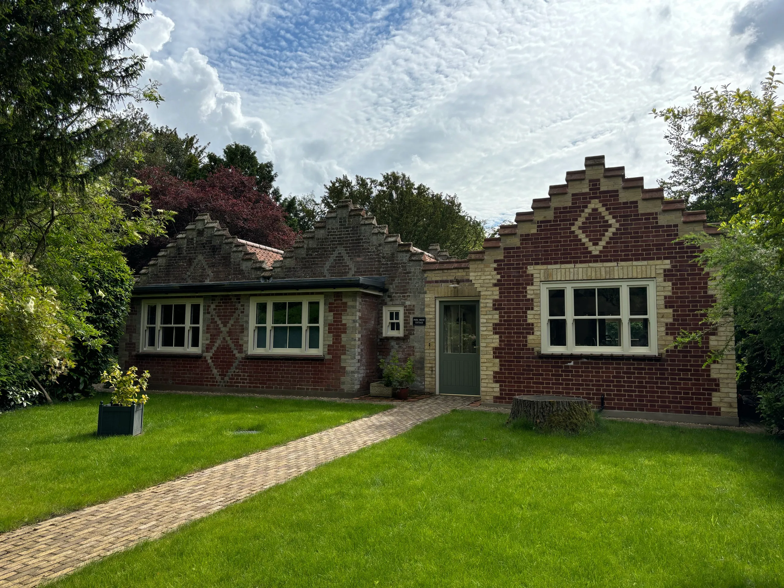 Park House Cottage — front elevation with decorative stepped parapet gables and diaper brickwork