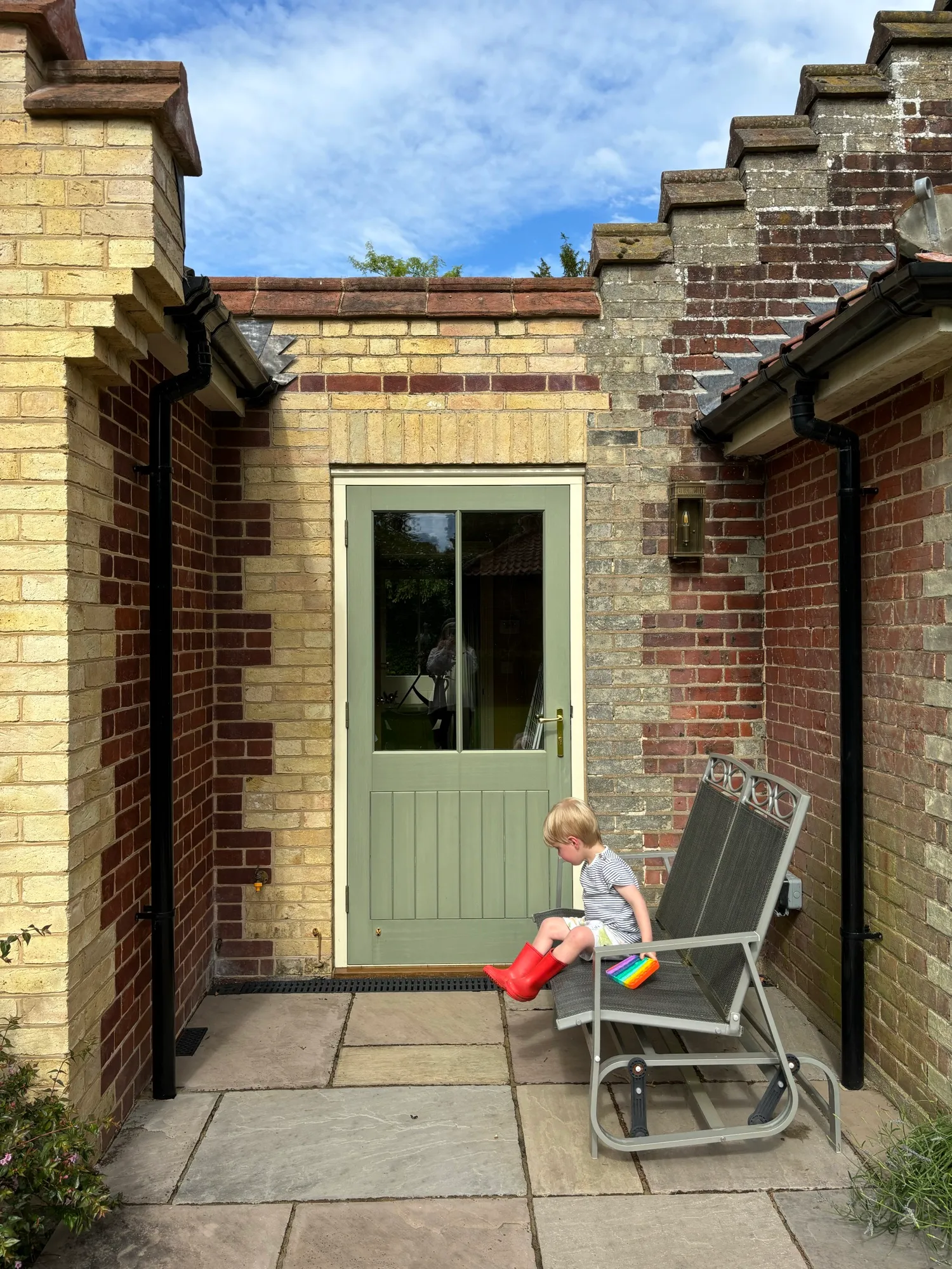 The new rear door and terrace, with brickwork matched to the original cottage