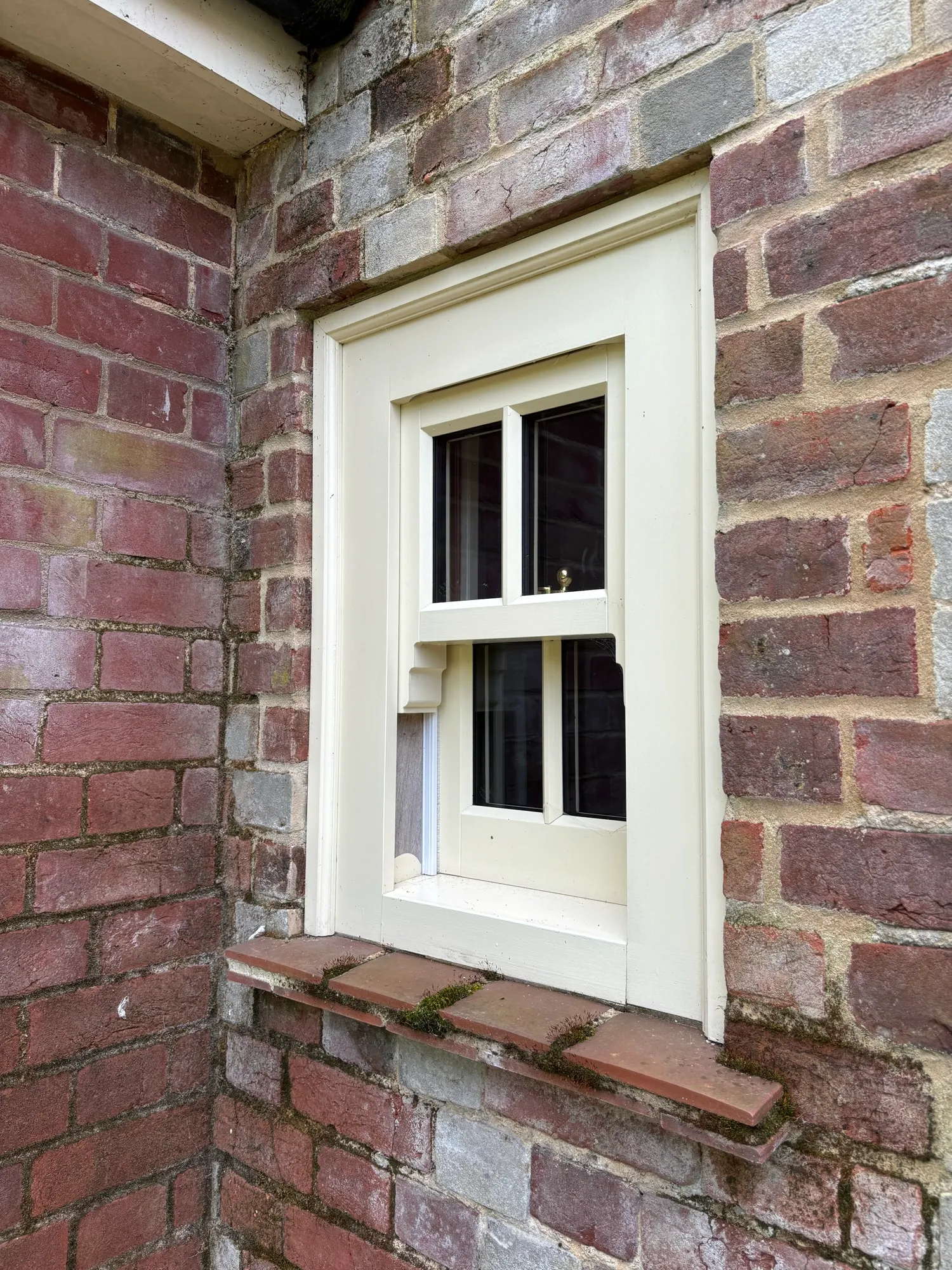 A restored double glazed sash window set into the original brickwork